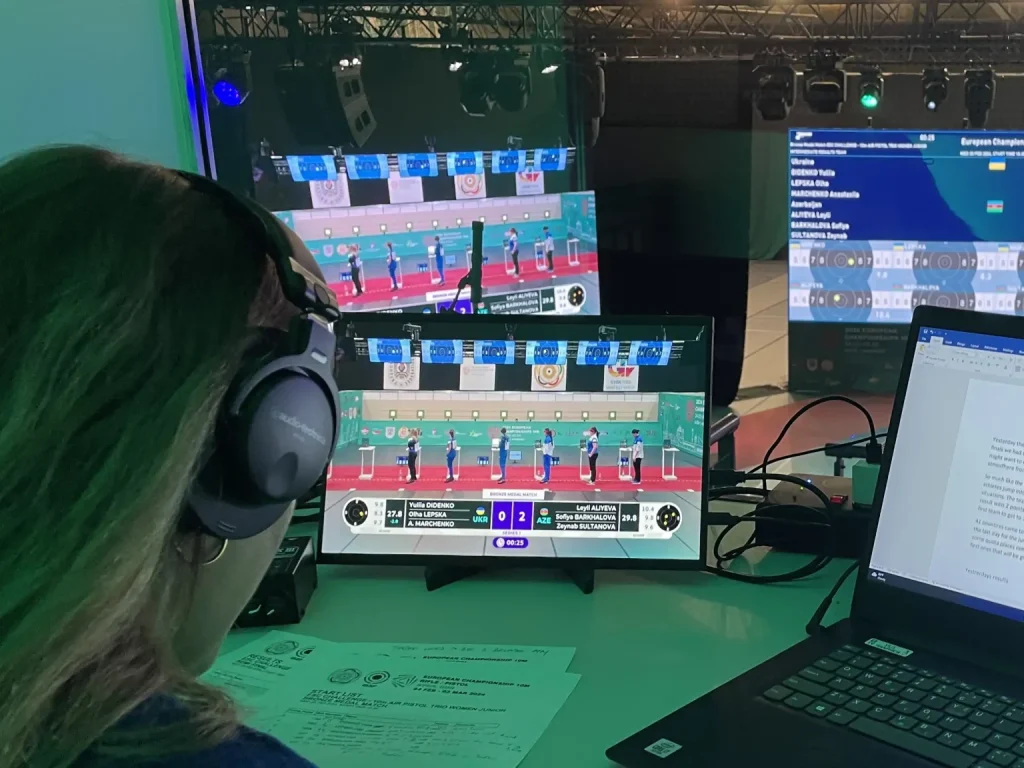 Live scoreboard graphics in front of the monitor